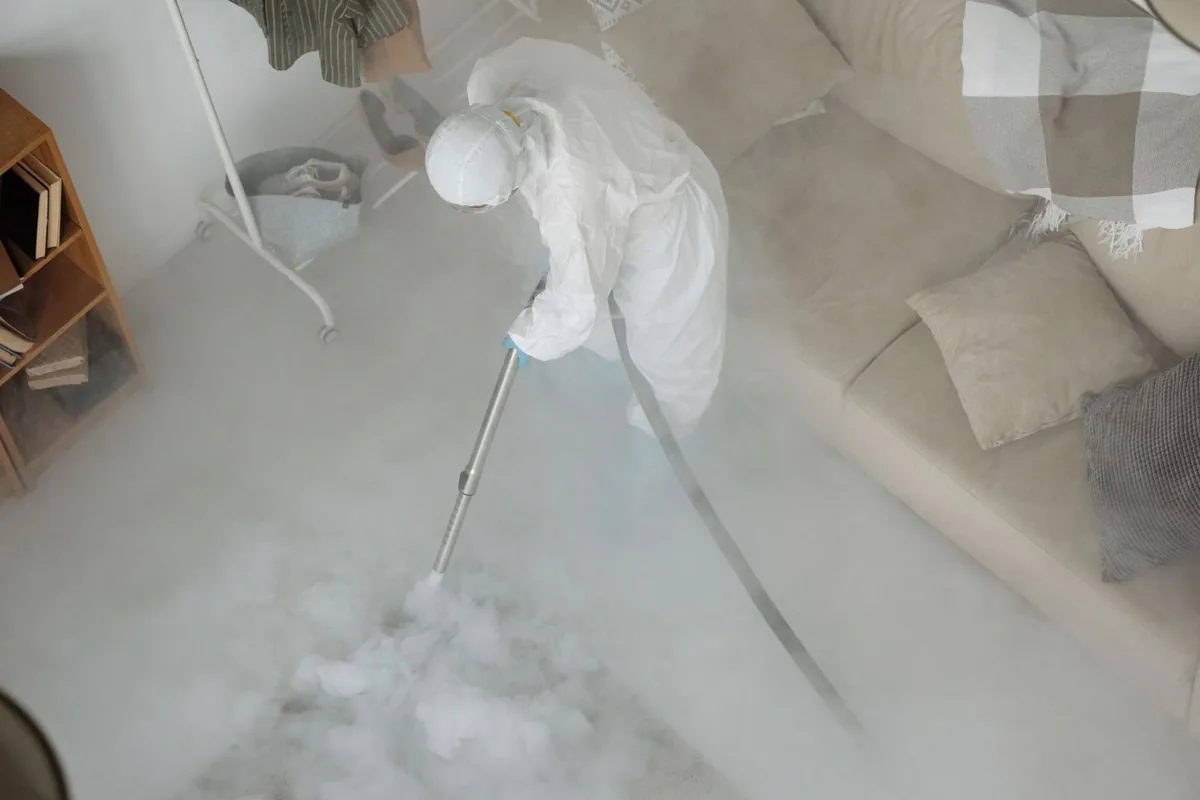 Biohazard cleanup technician in protective equipment, Pine Level, AL